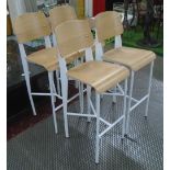 BAR STOOLS, a set of four, bentwood seats on metal supports.