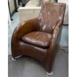 ARMCHAIR BY MONTIS, tan brown grained leather upholstered with cushion and round metal supports,