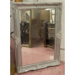 WALL MIRROR, silvered swept frame, with bevelled rectangular plate, 111cm x 80cm.