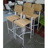 BAR STOOLS, a set of four, bentwood seats on metal supports.