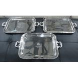 SERVING TRAYS, a set of three, plated silvered metal, French designs, 58cm L x 36cm W.