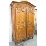 ARMOIRE, Louis XV style cherrywood with two carved doors enclosing shelves and a hanging rail,