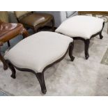 FOOTSTOOLS, a near pair, in neutral fabric.