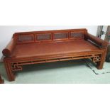 DAYBED, Chinese elm, with rattan seat and pierced panel back, 69cm H x 180cm W x 71cm D.