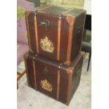 TRUNKS, a pair, faux crocodile skin patterened, with armorial plaque, 61cm L x 40cm W x 55cm H.