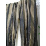 CURTAINS, a pair, in black with gold and black striped fabric lined and interlined,