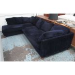 CORNER SOFA, by Flexform, in a Prussian blue velvet with goose down cushioning,