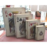 WOODEN STORAGE BOOKS, 'playing cards' designs, a graduated set of four, with lined interiors,