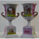 PAIR OF DRESDEN DECORATIVE DOUBLE HANDLED PORCELAIN URNS ON STANDS