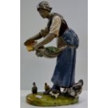 LARGE FRENCH POTTERY FIGURINE OF A LADY FEEDING HENS