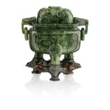 BURMESE JADE CARVED MINIATURE TRIPOD CENSER AND COVERQING DYNASTY, 19TH CENTURYcarved in the archaic