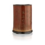 INSCRIBED BAMBOO BRUSHPOTQING DYNASTY, 18TH CENTURYof natural lobed form, the exterior carved with a