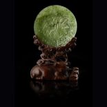 FINELY CARVED SPINACH-GREEN JADE SMALL DISHQING DYNASTYthe dish raised on a short foot-ring, the