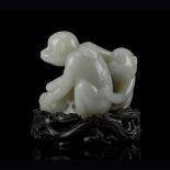 LARGE PALE CELADON JADE 'MONKEY AND PEACH' GROUPQIANLONG PERIODskilfully carved to show two