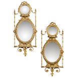 PAIR OF GEORGE III STYLE GILTWOOD AND GESSO GIRANDOLES 19TH CENTURY each with a oval mirror plate