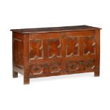 GEORGE II OAK MULE CHEST 18TH CENTURY the hinged top over a four panel moulded front with a pair