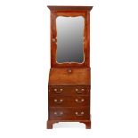 GEORGE II MAHOGANY BUREAU BOOKCASE 18TH CENTURY of small size, the dentil moulded cornice above a