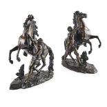 PAIR OF FRENCH BRONZE MARLEY HORSE FIGURE GROUPS 19TH CENTURY dark brown patina, on naturalistic