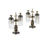 PAIR OF REGENCY PATINATED AND GILT BRONZE CANDELABRA EARLY 19TH CENTURY each with a central palmette