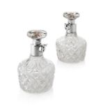 PAIR OF ASPREY CUT GLASS AND SILVER MOUNTED LOCKING DECANTERS SILVER MARKED BIRMINGHAM, 1927