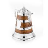 LARGE VICTORIAN OAK AND SILVERPLATED MOUNTED PRESENTATION FLAGON 19TH CENTURY of tapered form with a