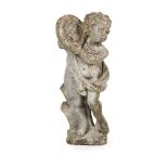 COMPOSITION STONE GARDEN FIGURE EARLY 20TH CENTURY modelled as a putto holding a tambourine,
