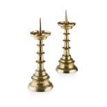 PAIR OF DUTCH BRASS PRICKET CANDLESTICKS 17TH CENTURY the circular indented hollow drip trays