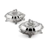 PAIR OF SILVER PLATED ENTREE DISHES, COVERS AND STANDS each of lobed square form, ornately cast with