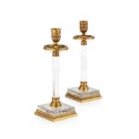 PAIR OF FRENCH GILT METAL AND GLASS CANDLESTICKS 20TH CENTURY with urn nozzles and laurel