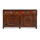 GEORGE I OAK DRESSER BASE EARLY 18TH CENTURY the moulded rectangular top over three short drawers