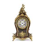 FRENCH BOULLE MANTEL CLOCK 19TH CENTURY the gilt metal and enamel embossed dial with black Roman