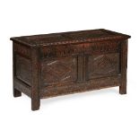 ENGLISH CARVED OAK CHEST 17TH CENTURY the hinged two panel top above a two panel front, carved all