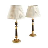 PAIR OF RESTAURATION STYLE GILT AND PATINATED BRONZE LAMPS converted from candlesticks, with urn-