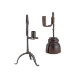 TWO WROUGHT IRON RUSH LIGHT AND CANDLEHOLDERS 17TH CENTURY the first with a hinged arm terminating