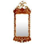 GEORGE III IRISH MAHOGANY AND GILTWOOD MIRROR 18TH CENTURY the shaped rectangular mirror plate in