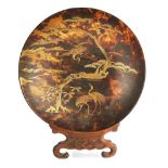 JAPANESE LACQUER TORTOISESHELL DISH MEIJI PERIOD of shallow form raised on a horn foot, decorated