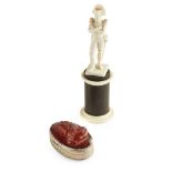 FRENCH CARVED IVORY FIGURE OF NAPOLEON 19TH CENTURY the standing figure on an ebonised wood and