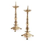 PAIR OF CONTINENTAL BRASS PRICKET CANDLESTICKS 17TH CENTURY each with a dished drip tray and knopped