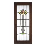 GLASGOW STYLE PAIR OF STAINED GLASS PANELS, CIRCA 1900 each depicting a stylised plant form, oak