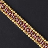 MOUAWAD - A ruby and diamond set braceletcomposed of a single row of floral clusters, each collet