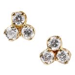 A pair of diamond cluster earrings each set with a cluster of three round brilliant cut diamonds,
