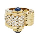 A sapphire and diamond set cocktail ringof broad curving design with ribbed detail, pavé set