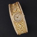 A diamond set bangle watchthe tapering bangle with diamond set border, textured ground to the