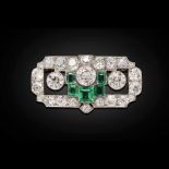 A 1930s emerald and diamond set broochof rectangular geometric design with pierced detail,