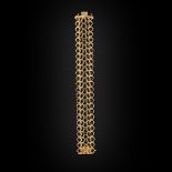 A contemporary gold braceletcomposed of a broad design of textured interlocking circles, with a