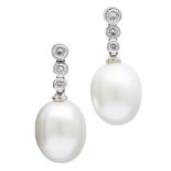 A pair of pearl and diamond set earringseach collet set with three graduated round brilliant cut