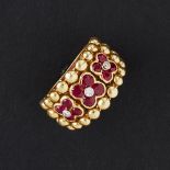 MOUAWAD - A ruby and diamond set ringof broad beaded design, set with three tapered floral