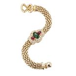 A multi-gem set braceletthe central removable motif collet set with a cabochon emerald flanked to