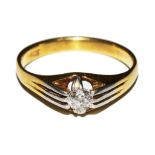 A gypsy set diamond ring set in 18 carat gold