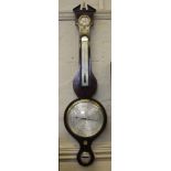 A George III mahogany barometer with boxwood and ebony stringing, broken pediment top with brass